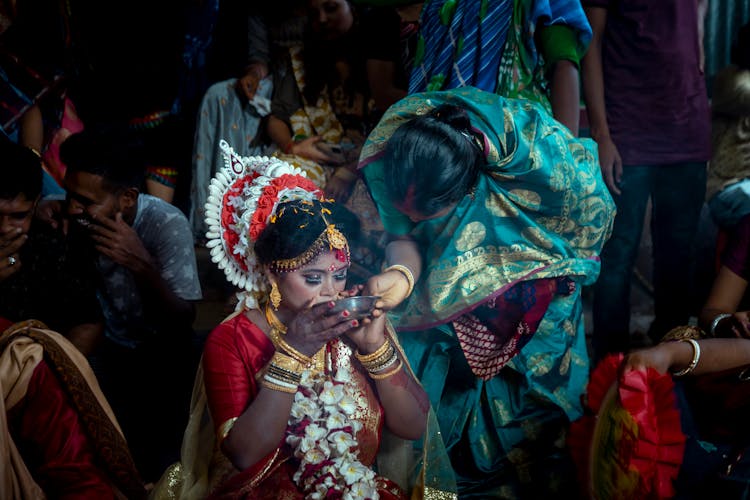 Indian Dancer Drinking At Ceremony