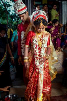 South Asian couple during a vibrant traditional Indian wedding ceremony.