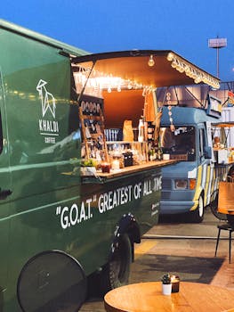 Colorful food trucks at a festive night market. Coffee and treats served.