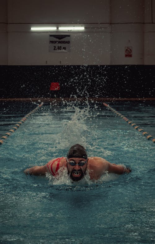 A Man Swimming in the Pool