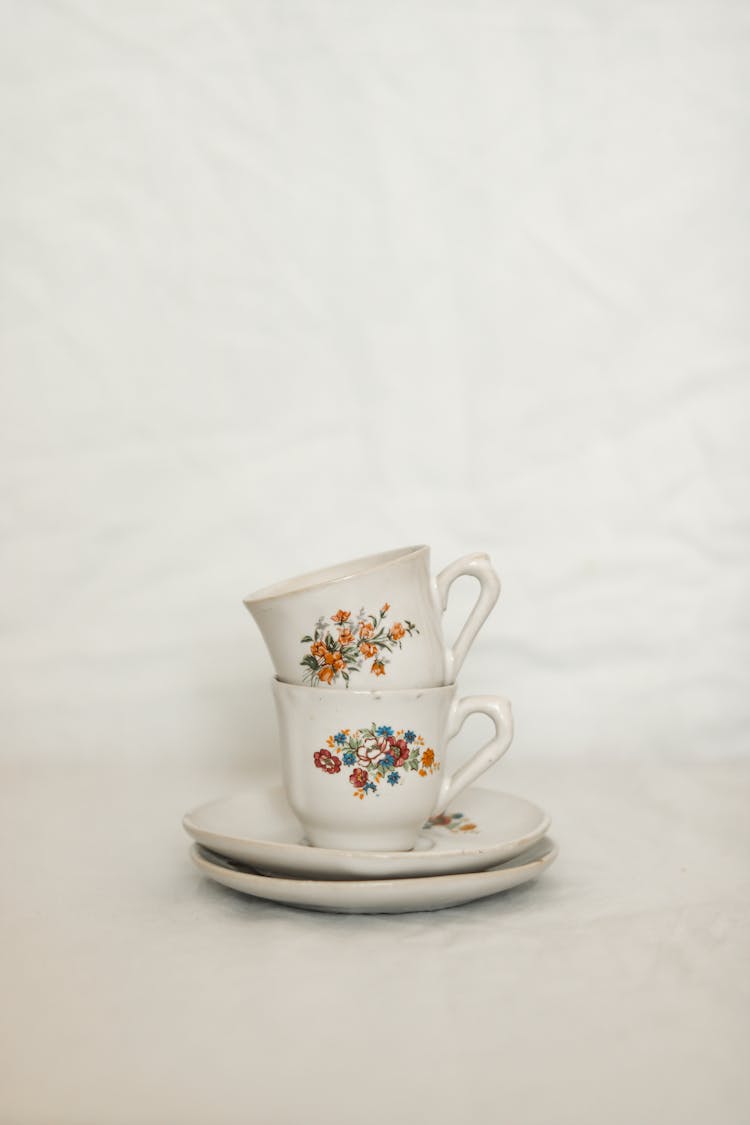 Porcelain Cups And Plates With Floral Patterns 