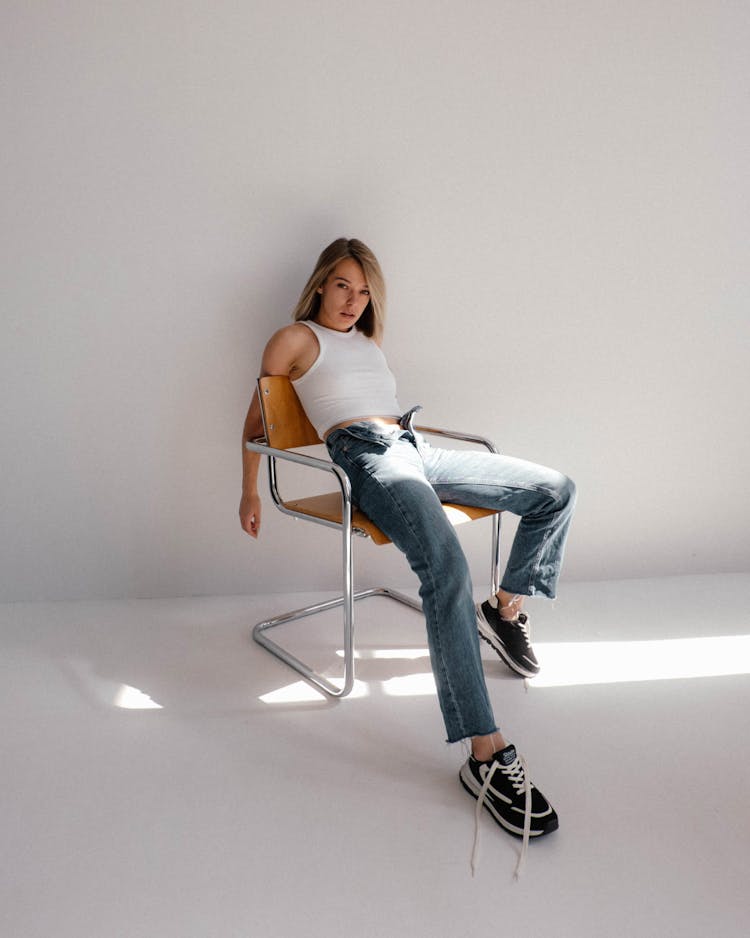 Woman Sitting In A Chair 