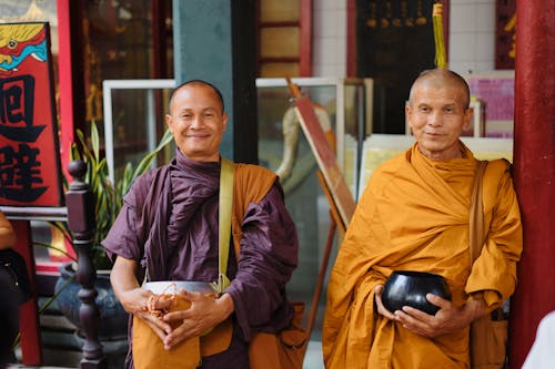 Two Happy Buddhist Monks Wearing Kasaya