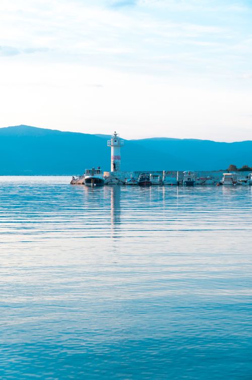 Free Lighthouse on calm Balıkesir waters, reflecting serene beauty in Türkiye. Stock Photo