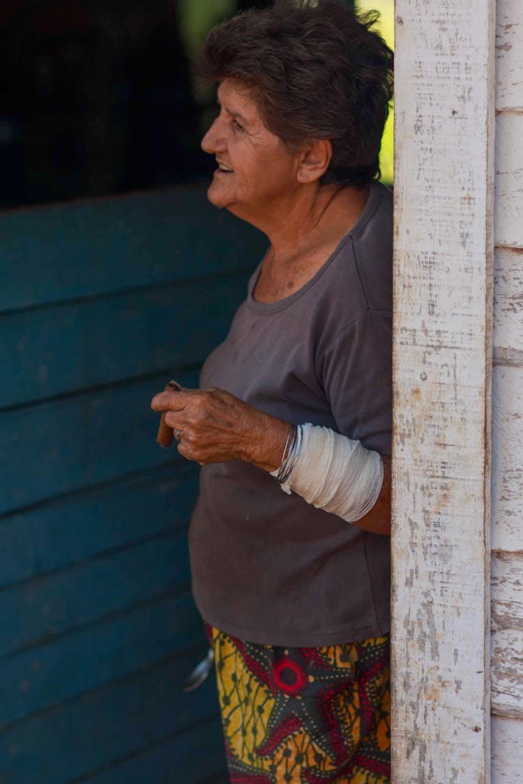 Elderly Woman Smoking A Cigar 