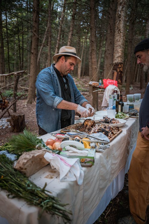 Man Cooking in Forest