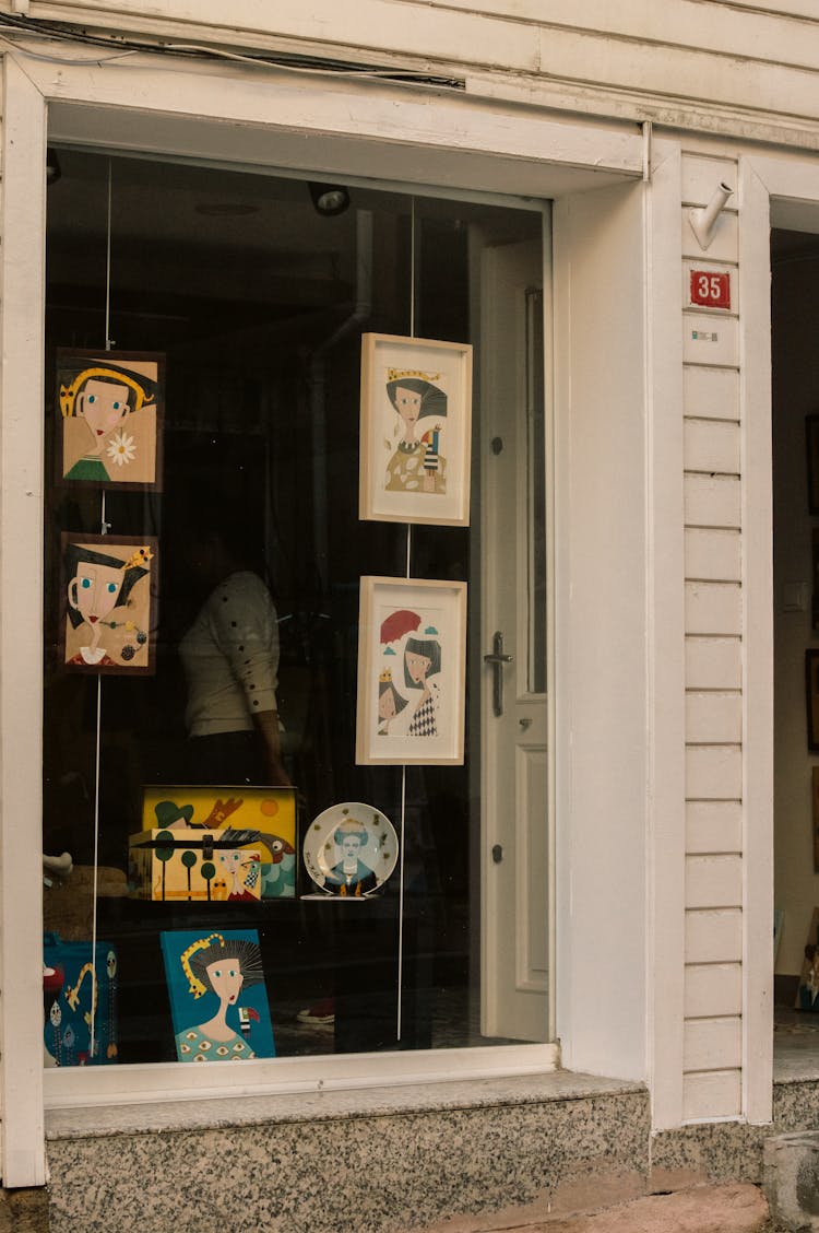 Simple Illustrations Displayed In Storefront Window