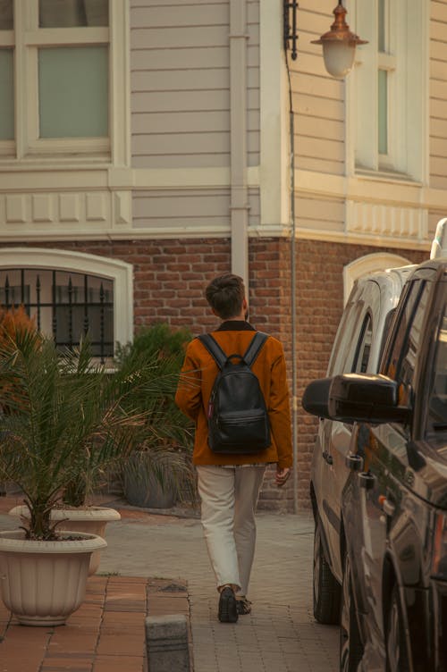 Back View of a Man Wearing a Black Backpack