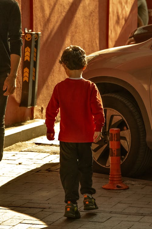 Back View of a Kid in a Red Sweatshirt