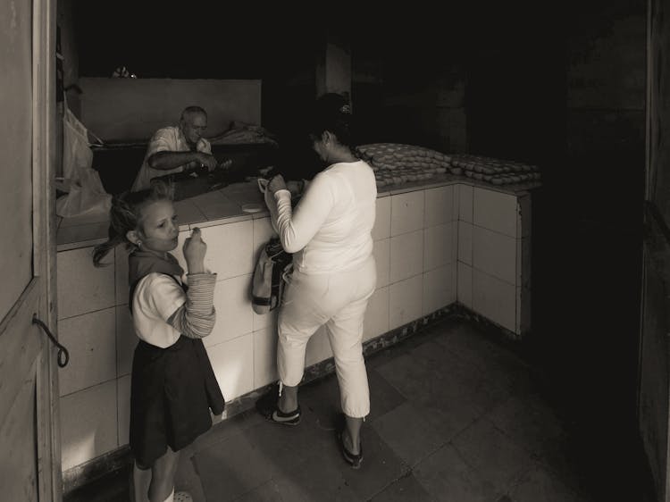 Black And White Photo Of Woman And Girl Shopping