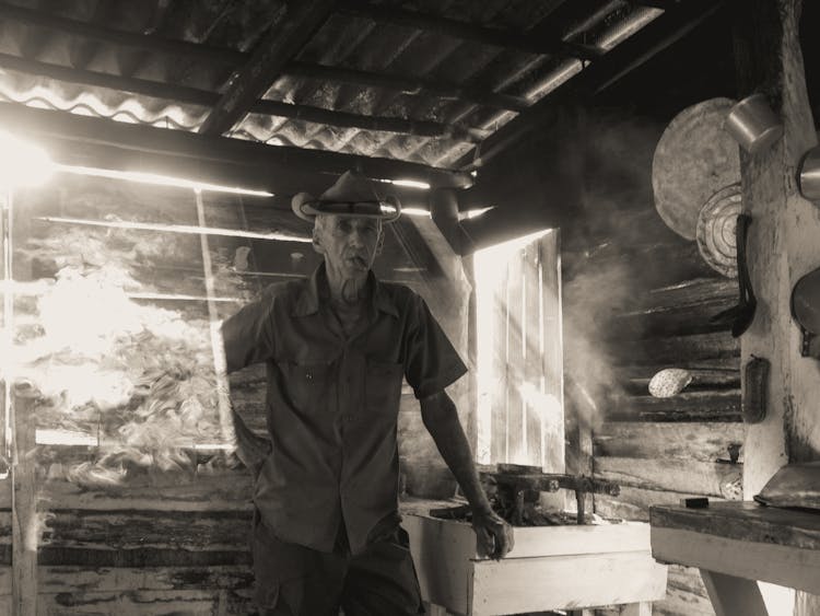 Elderly Man Smoking A Cigar 