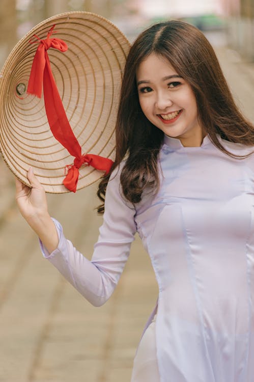 Free Woman Holding Hat Stock Photo