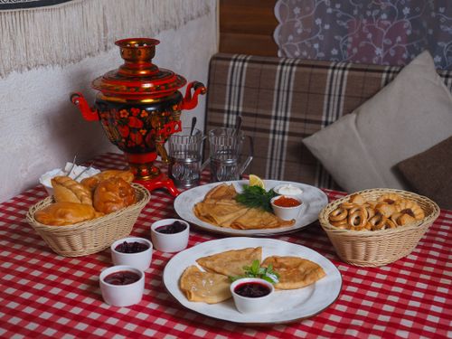 Free Cozy setting featuring traditional Russian breakfast with a samovar. Stock Photo