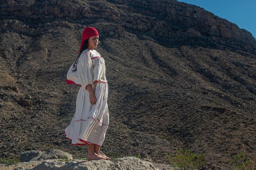 A Woman in White and Red Long Sleeve Dress