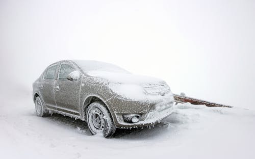 Frozen Car on Snow Covered Ground