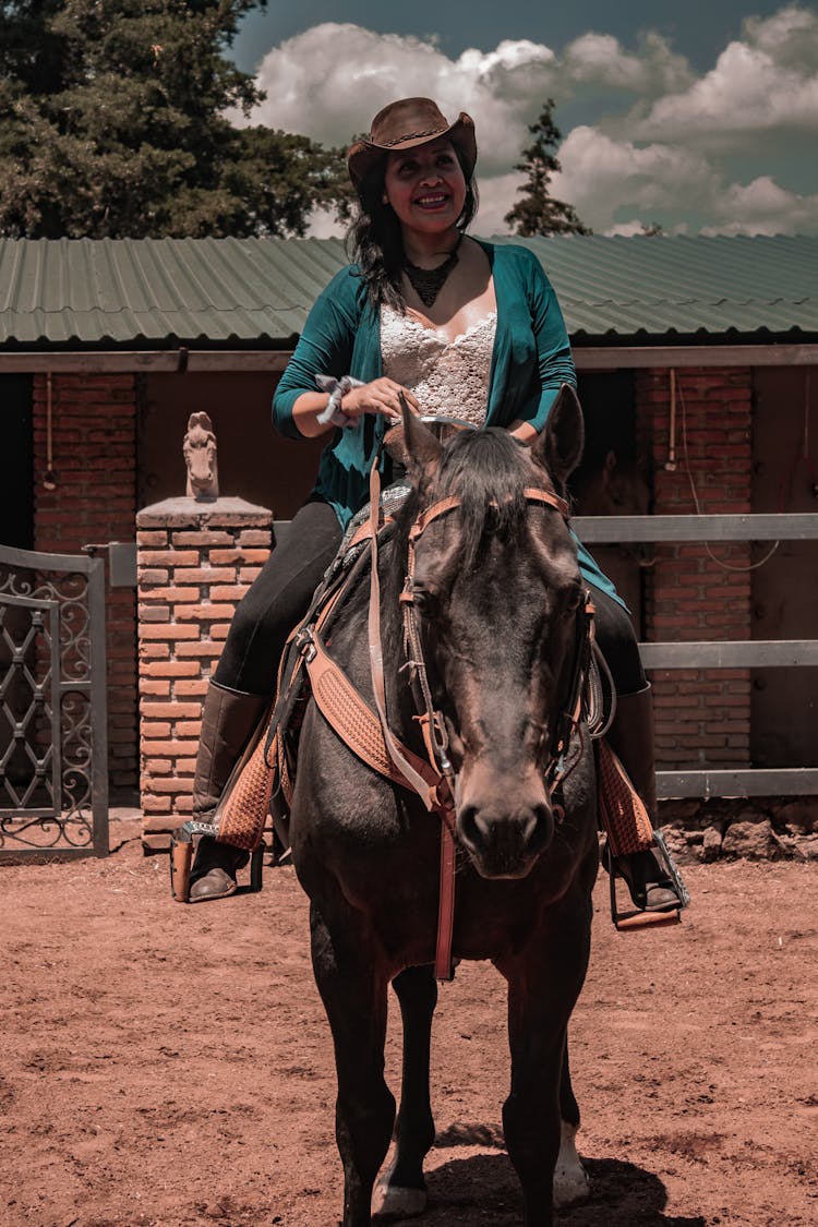 A Woman Riding A Horse