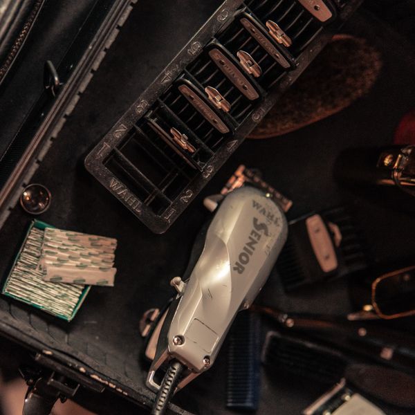 Top view of grooming tools including clippers and blades, photo by Ulises Leon on Pexels