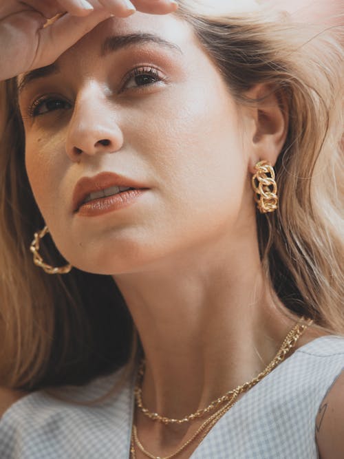 Close-up of a Woman Wearing Earrings 
