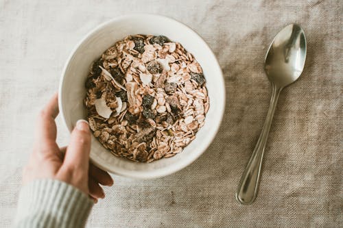 Free Person Holding Bowl Full of Oats Stock Photo