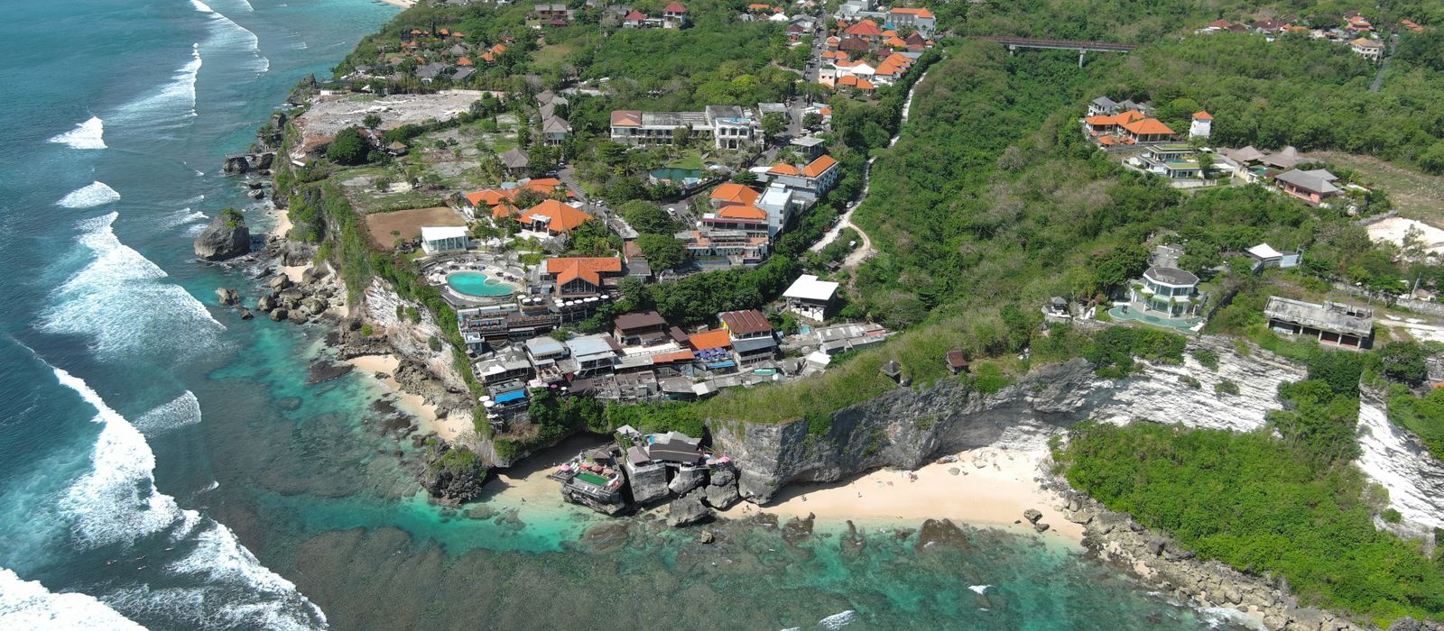 Scenic aerial view of South Kuta's rugged coastline and vibrant landscapes in Bali, Indonesia.