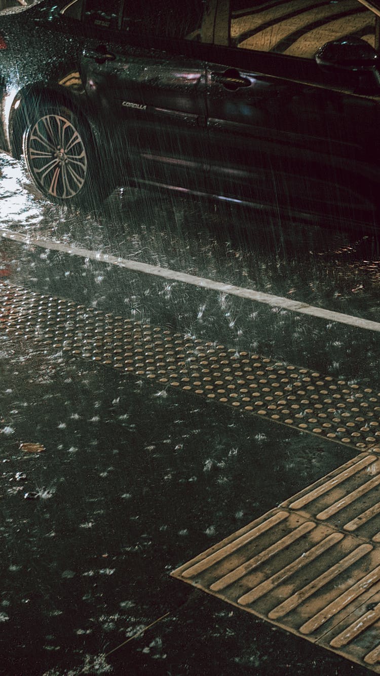 Photo Of A Car In The Rain 