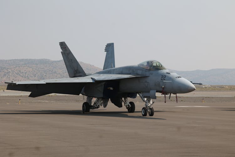 A Military Aircraft On A Runway