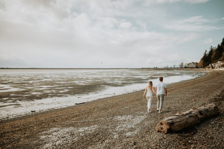 Couple Walking On The Beach 