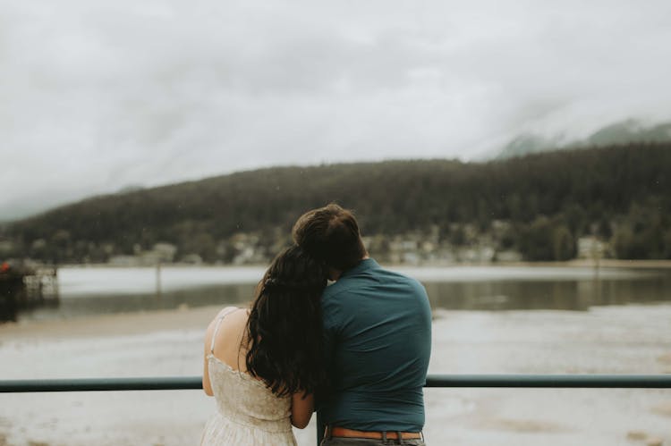 Couple Looking At The Lake