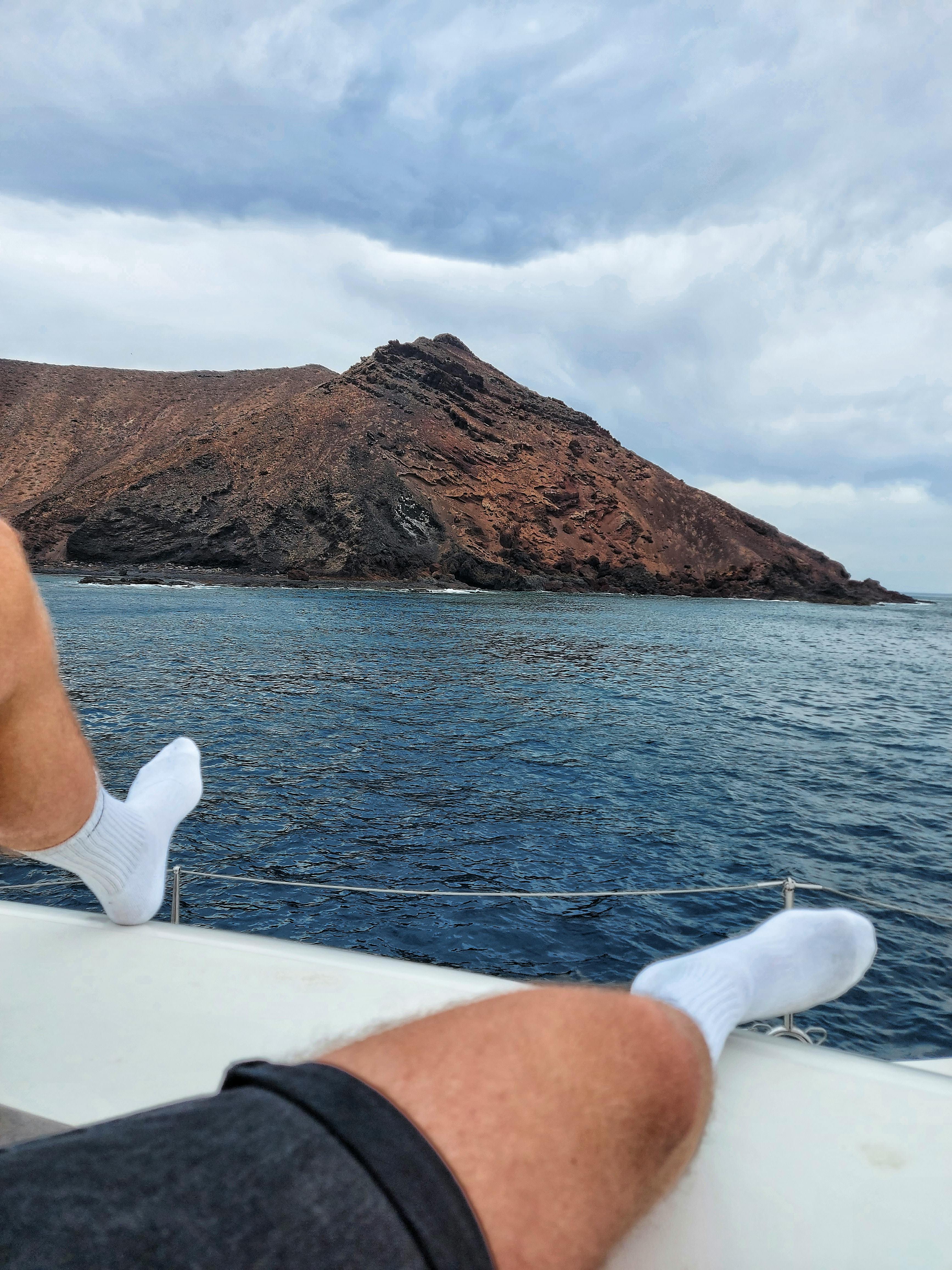 2 People Standing Sitting in a Boat on Body of Water · Free Stock