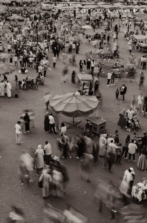 Blurry Aerial View of a Crowd on a Street Market 