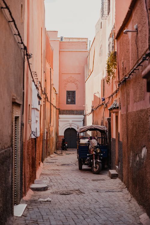 Free Discover the vibrant colors and unique culture of a narrow street in Marrakech, Morocco. Vibrant urban scene. Stock Photo