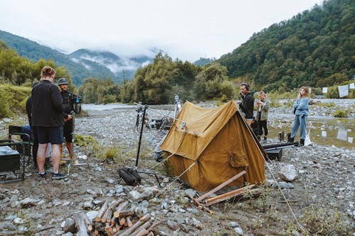 Film Crew and a Set Up Tent in Mountains 