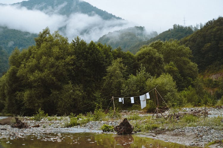 Laundry Drying By The River In A Mountain Valley 