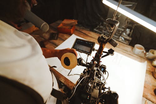 Man Filming with a Professional Camera 