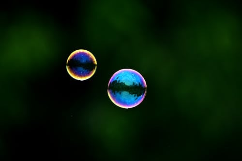 Floating Bubbles on Green Background