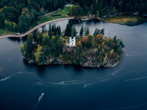 Aerial Footage of an Island with a White Monastery