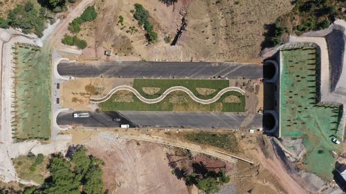 Free Drone shot of a road with green landscaped median in Nusratlı, Çanakkale, Turkey. Stock Photo