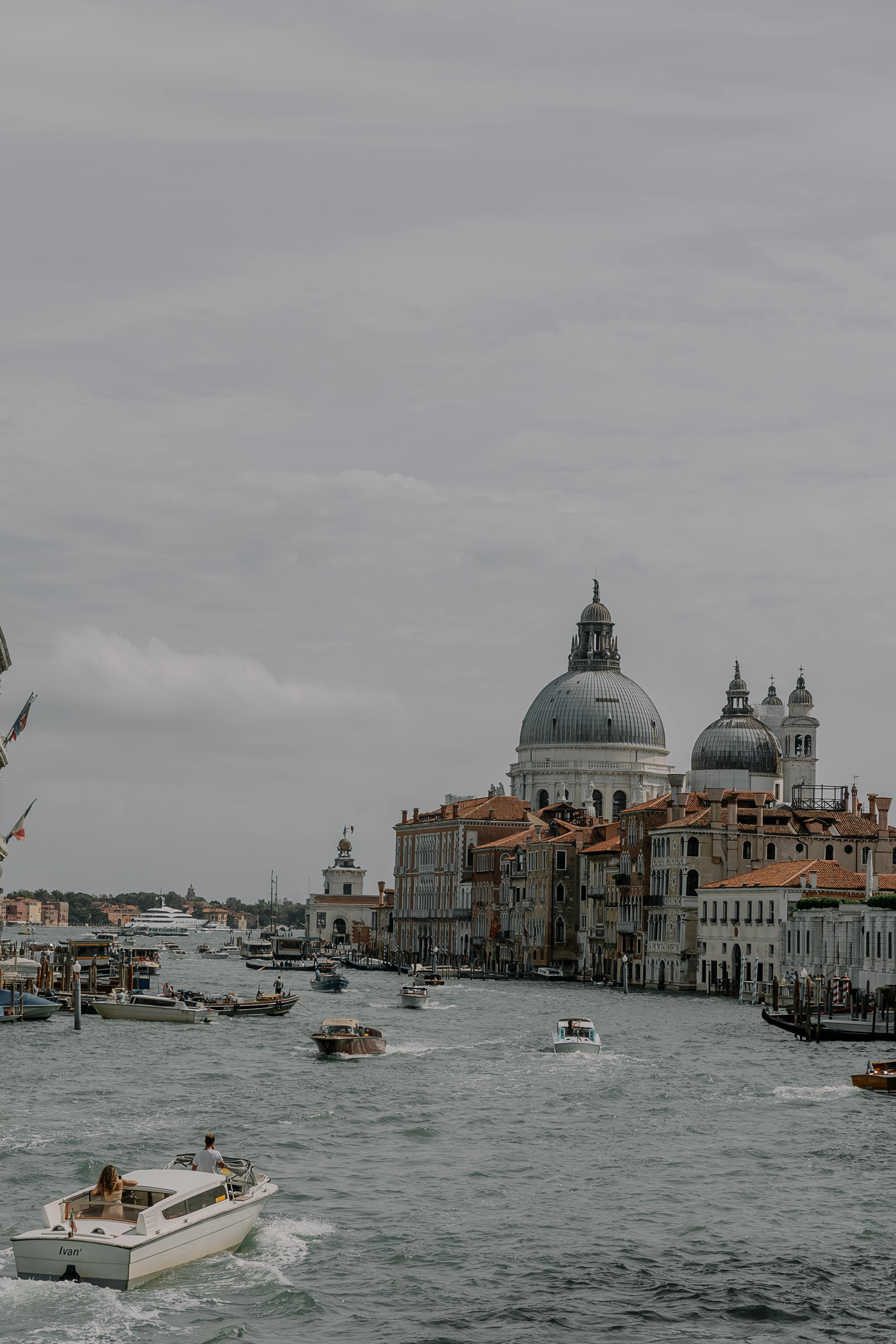 boats on the grand canal and the view on santa maria della salute venice italy