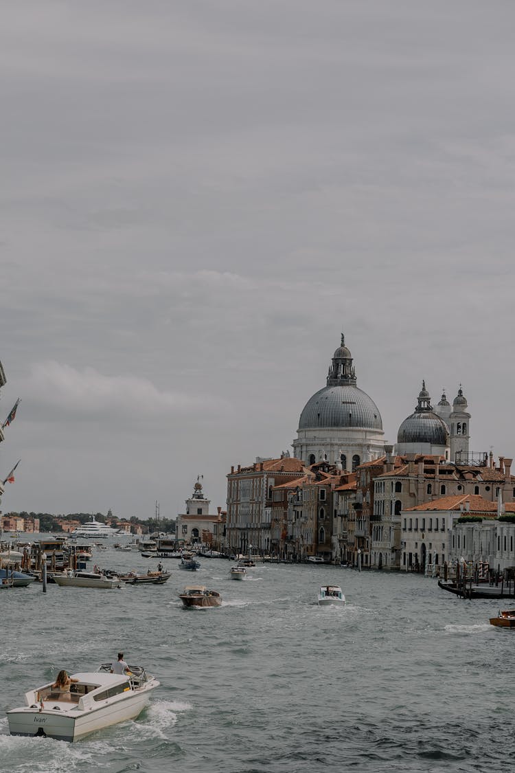 Boats On The Grand Canal And The View On Santa Maria Della Salute, Venice, Italy