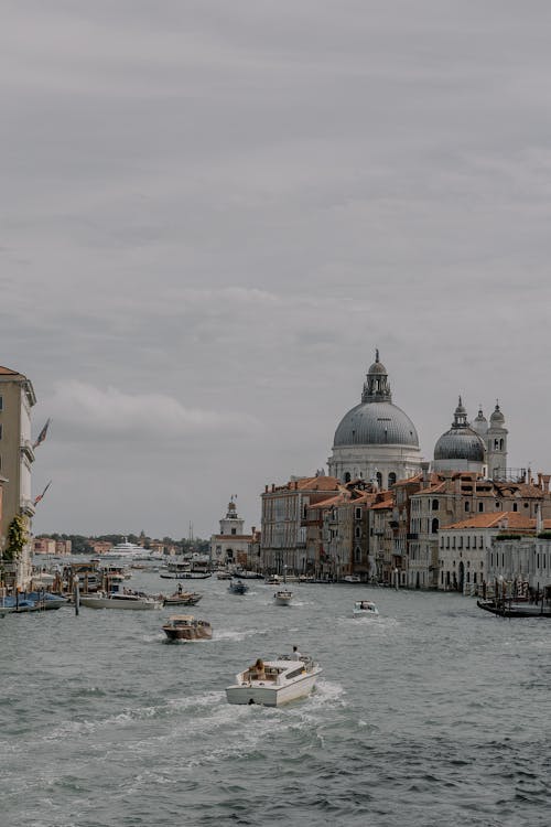 Boats on the Grand Canal and the View on Santa Maria della Salute, Venice, Italy 