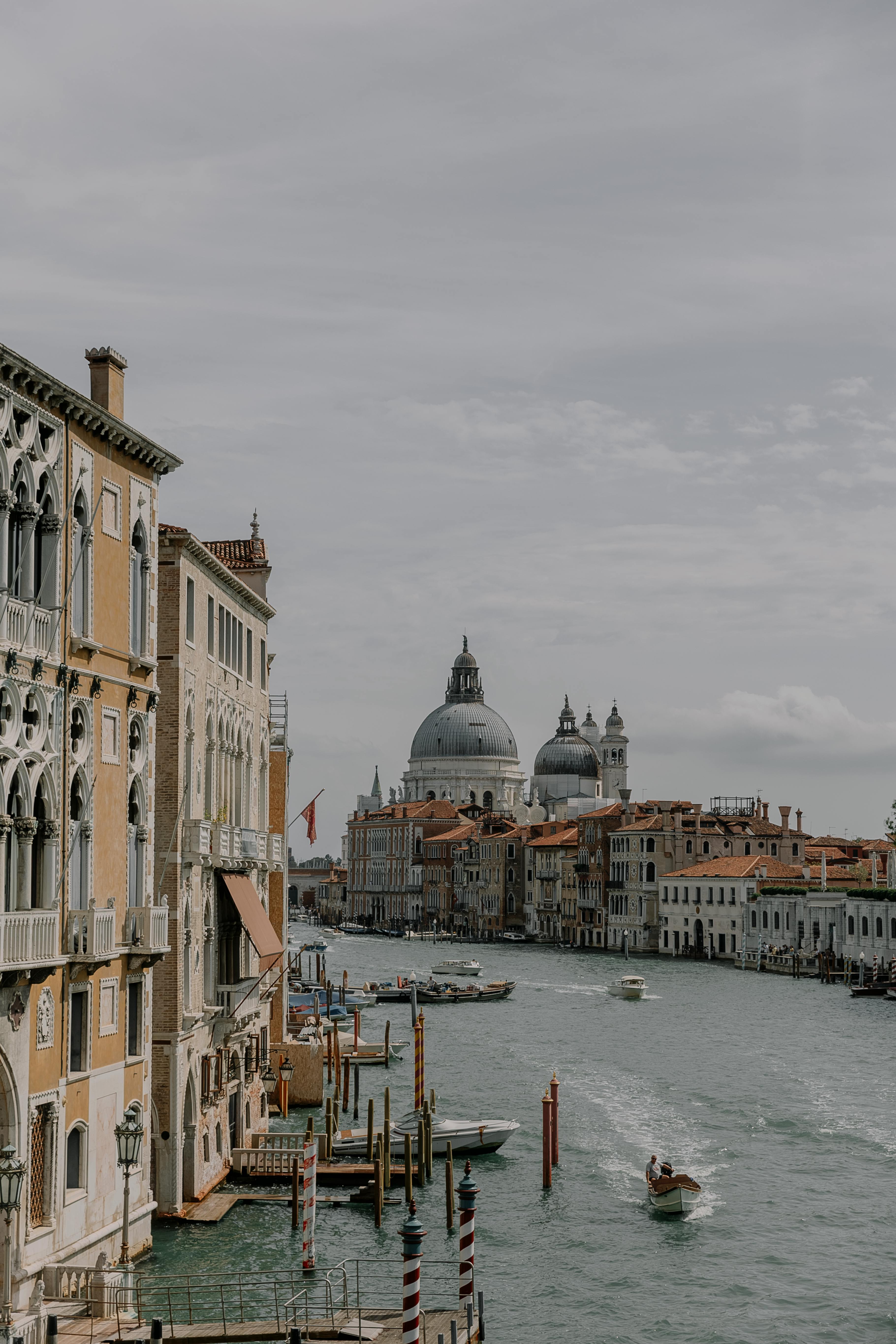 boats on the grand canal and the view on santa maria della salute venice italy