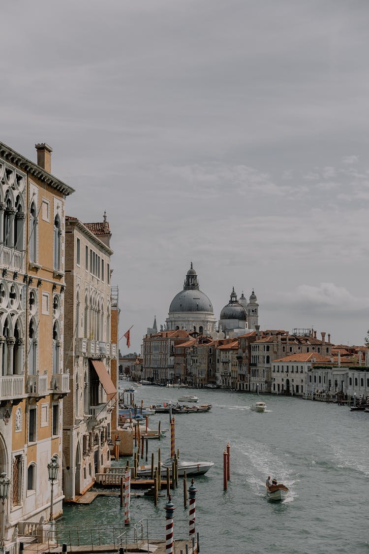 Boats On The Grand Canal And The View On Santa Maria Della Salute, Venice, Italy