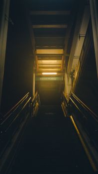 Mysterious, dimly, lit and stairway — photo by Tolga Aksoy
