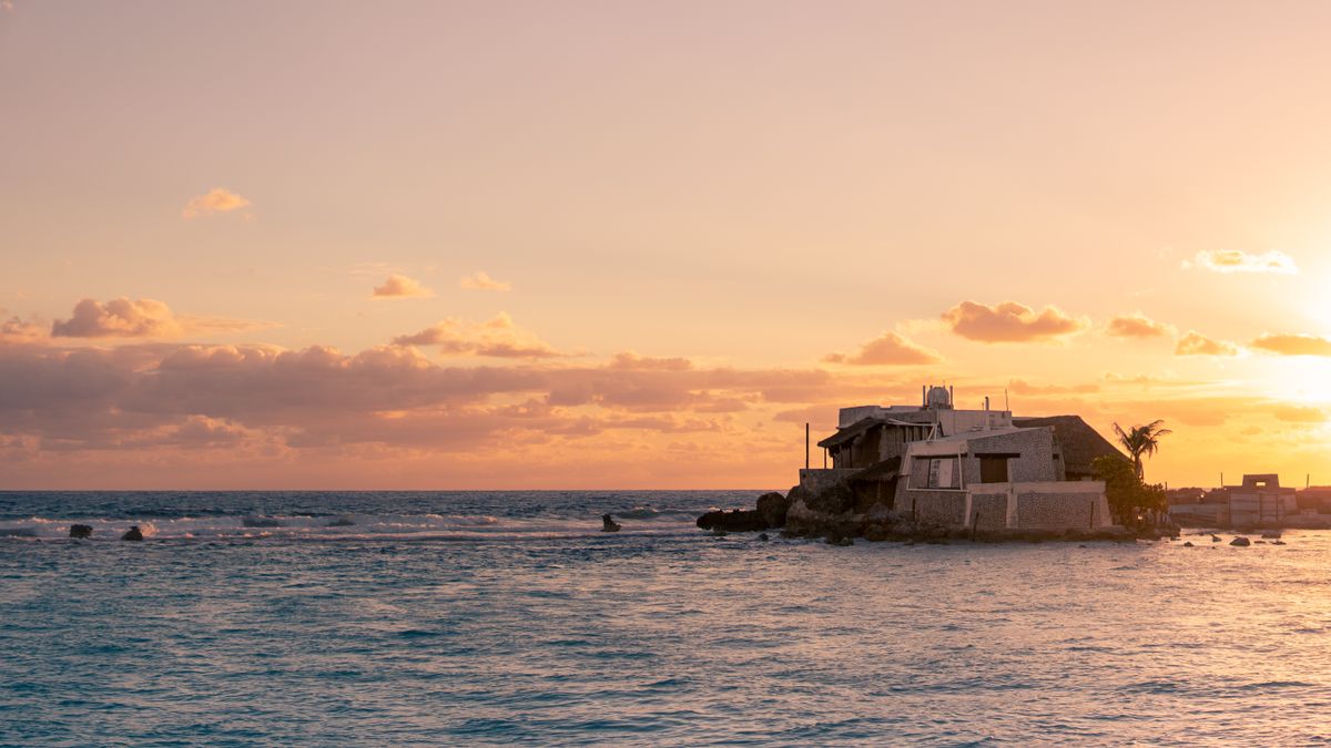 Cancún - Isla Mujeres - casă pe malul apei la apus