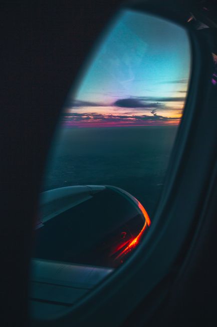 Breathtaking aerial view of a sunset sky from an airplane window. Perfect for travel and adventure themes.