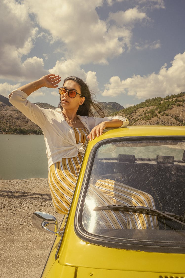 Woman Leaning From Car