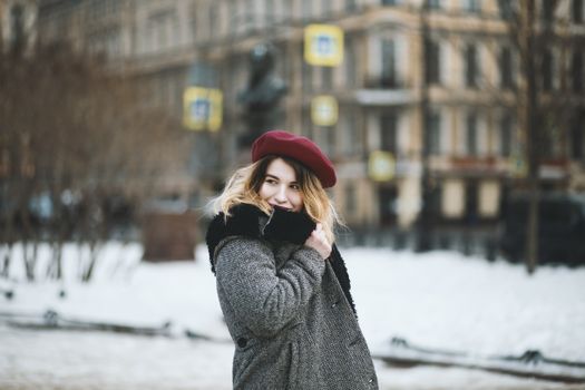 Woman Wearing Coat and Red Hat during Snowy Day