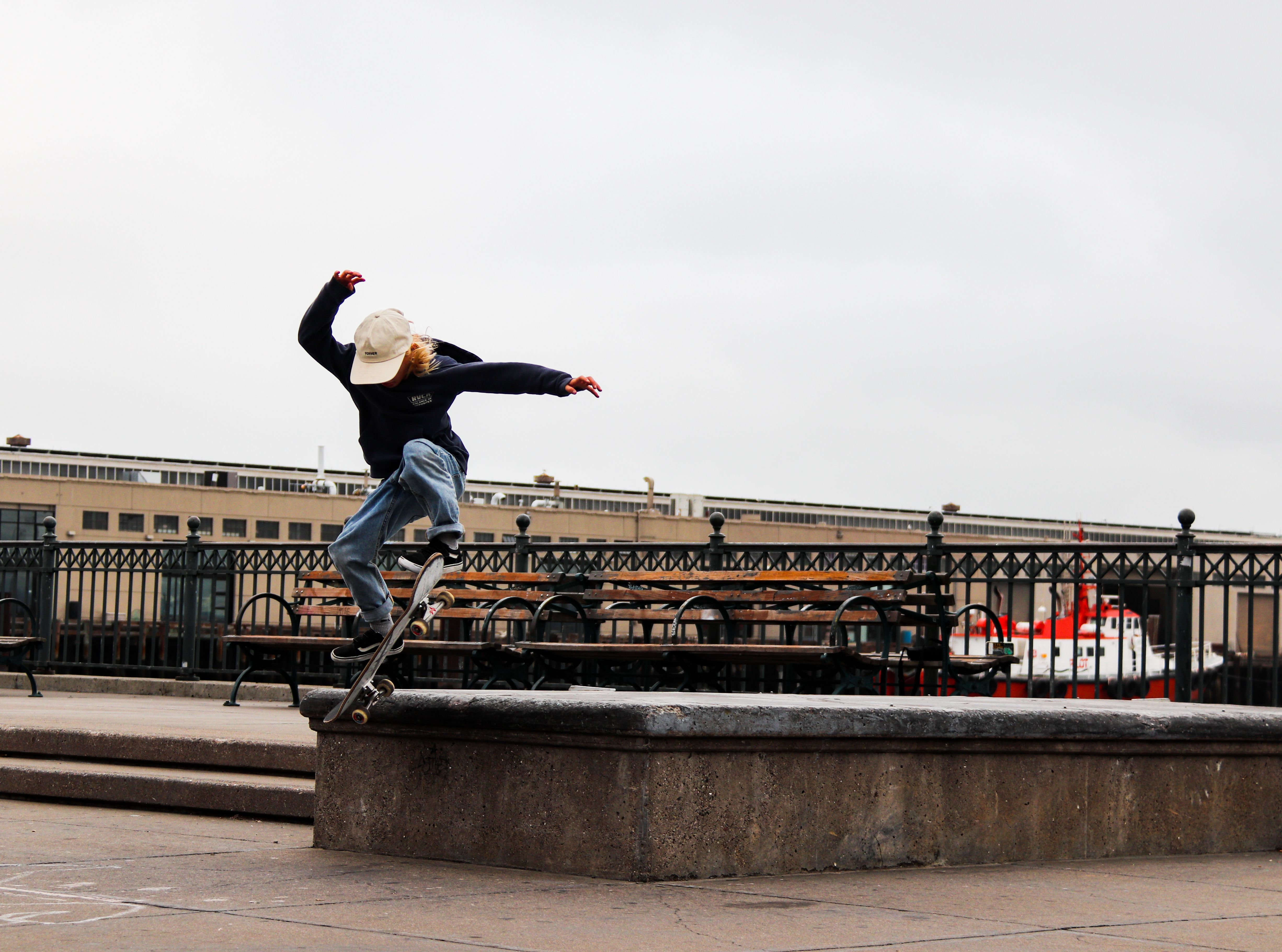 Skater Sliding on the Wall in the Harbor · Free Stock Photo