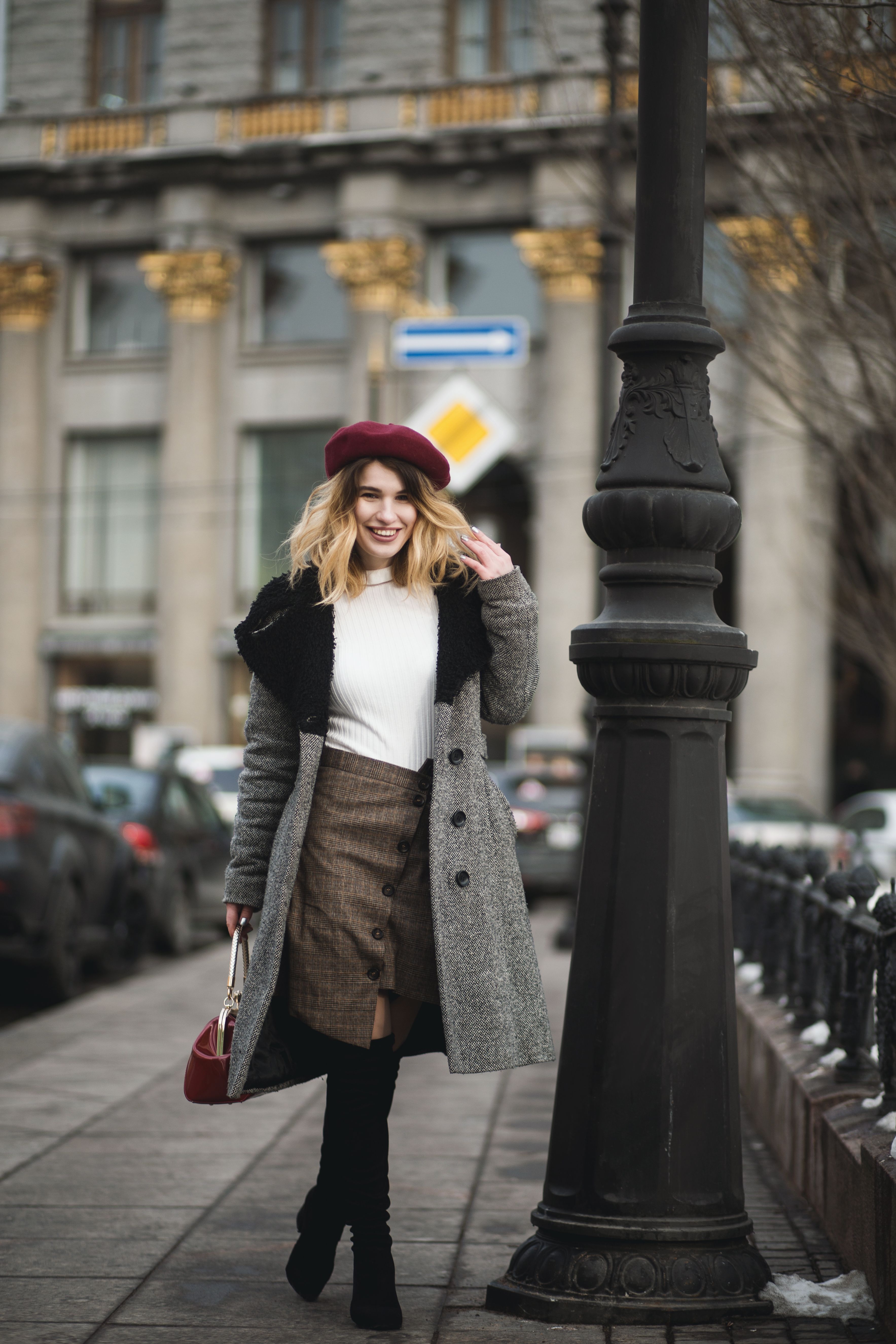 The long coat styled over wide trousers on the street