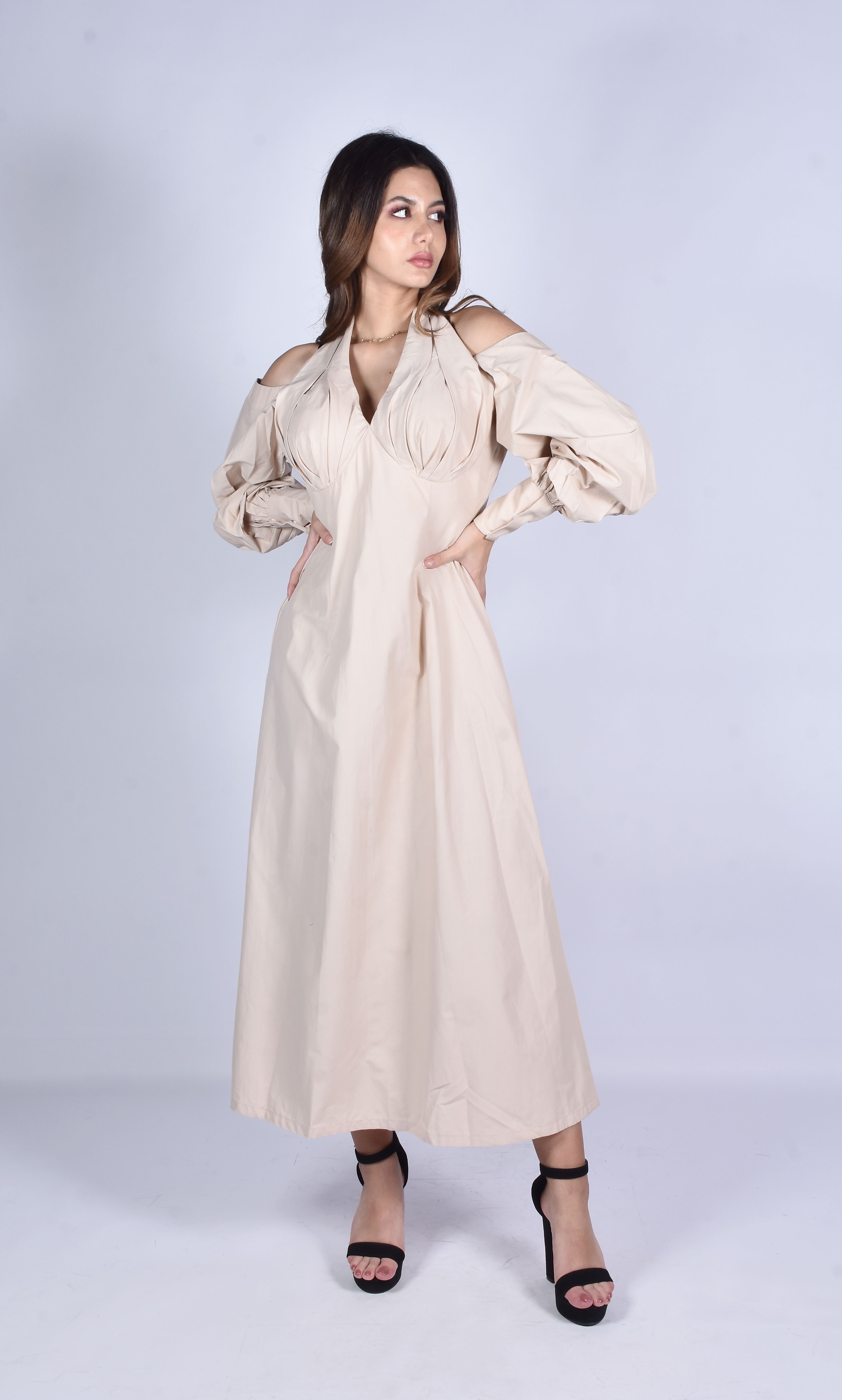 A Woman Wearing a Beige Dress · Free Stock Photo